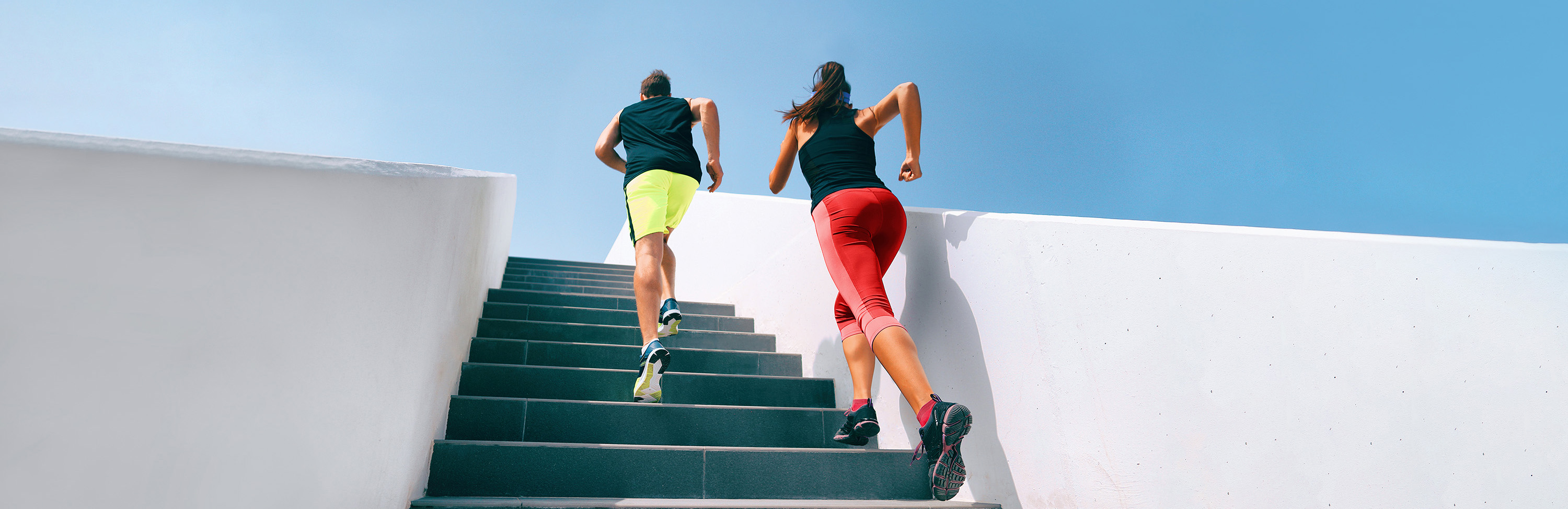 couple running on steps